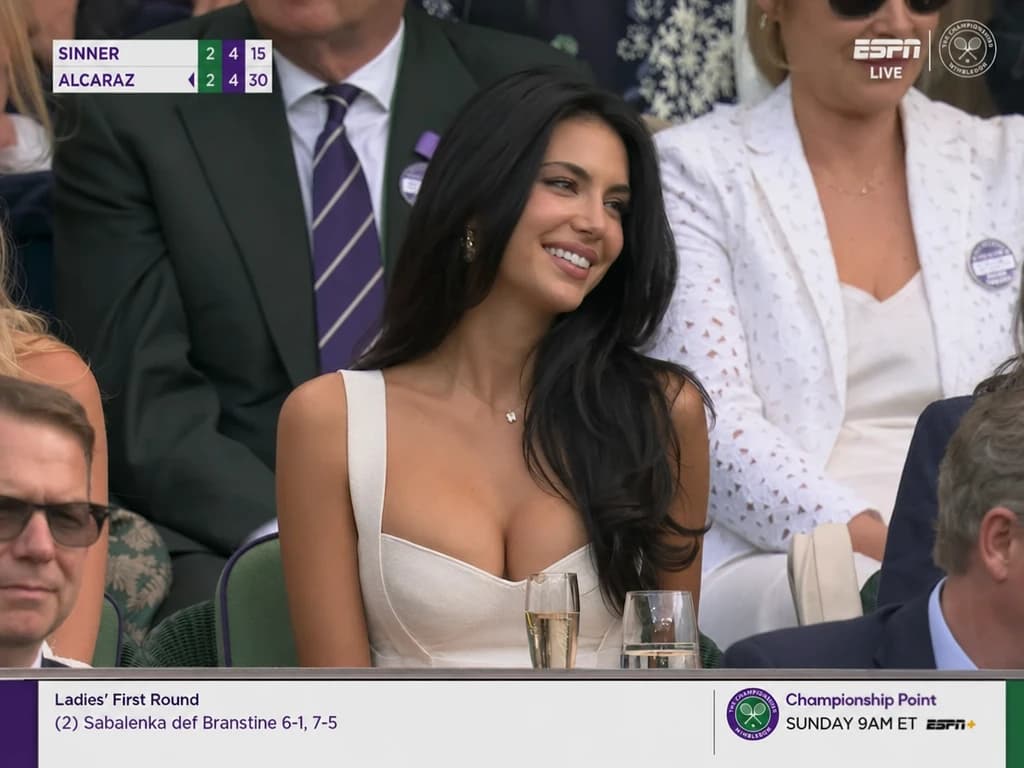 Tennis broadcast VIP audience shot generated from a prompt.